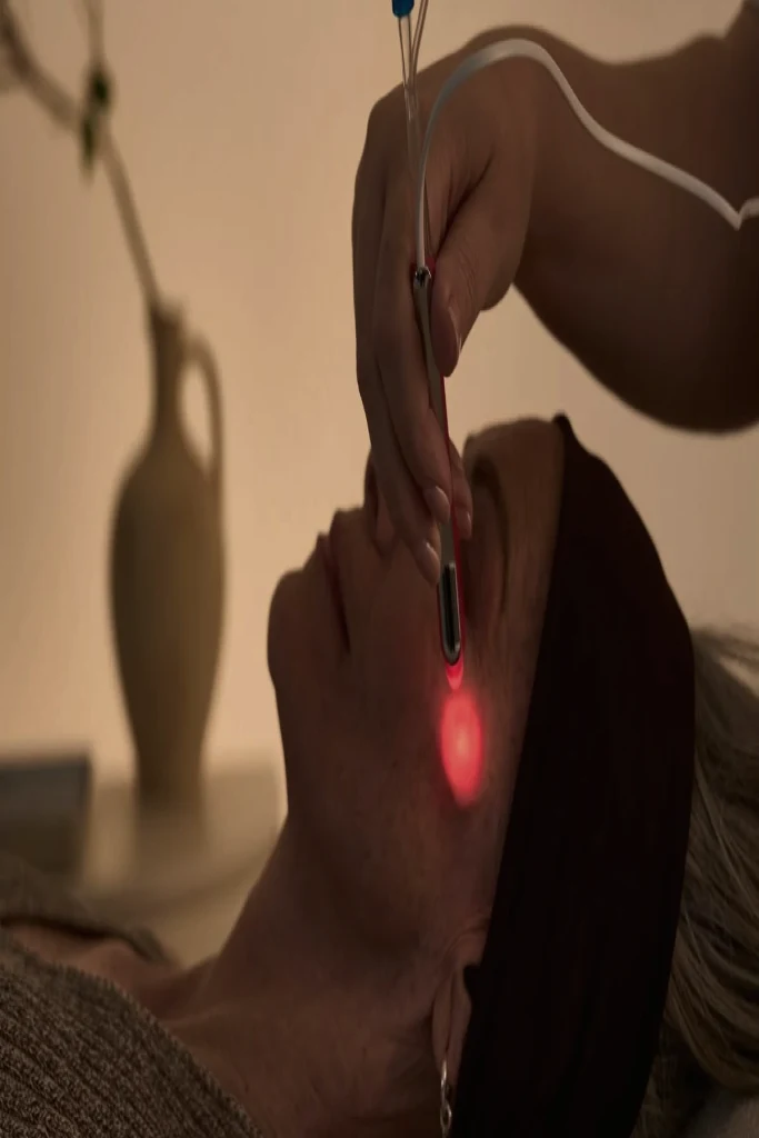 A facial treatment in a softly lit studio